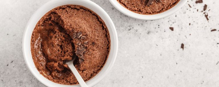 Protein-rich chocolate mousse in a glass topped with a crispy chocolate layer
